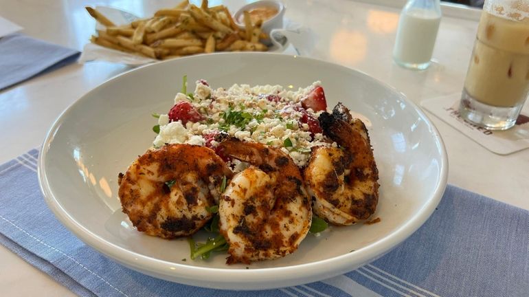 The "Summer Salad" featuring strawberries, goat cheese, pickled red onions...