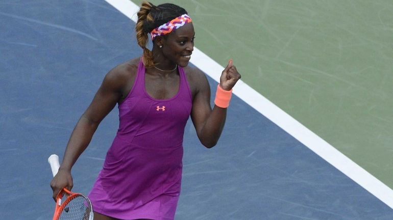 Sloane Stephens reacts to winning her match against Mandy Minella...