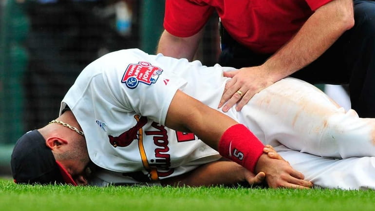 Pujols out six weeks with wrist injury from weekend collision