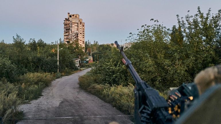 A Ukrainian soldier sits in his position in Avdiivka, Donetsk...