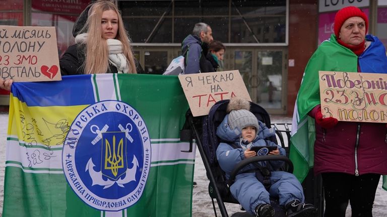 Kateryna Dmytryk, left, takes part in a prisoners of war...