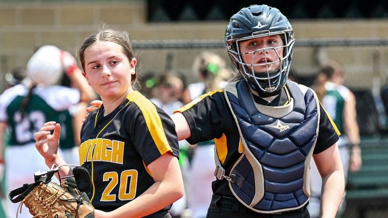 Lucy Olore of Wantagh, left, makes the catch on the...