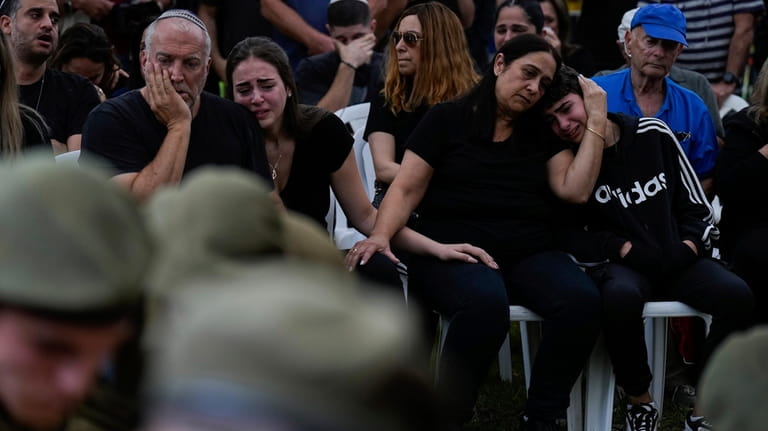 Family members of Sgt. Roni Eshel cry during her funeral...