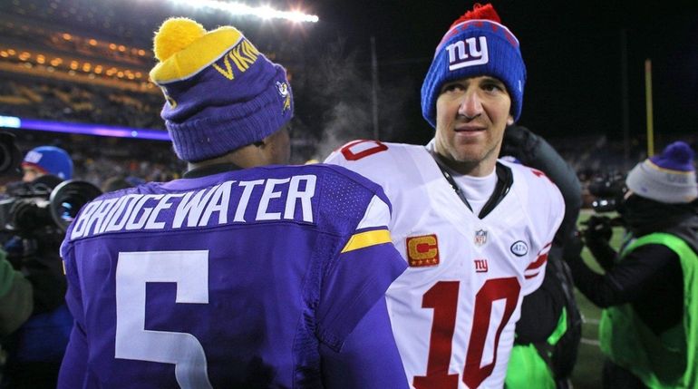 Eli Manning greets Vikings quarterback Teddy Bridgewater after Sunday's loss...