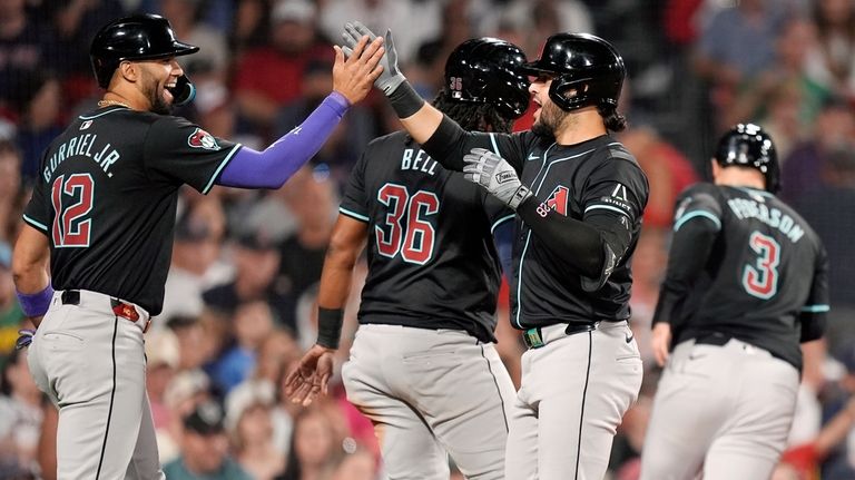 Arizona Diamondbacks' Eugenio Suárez, third from left, celebrates after his...