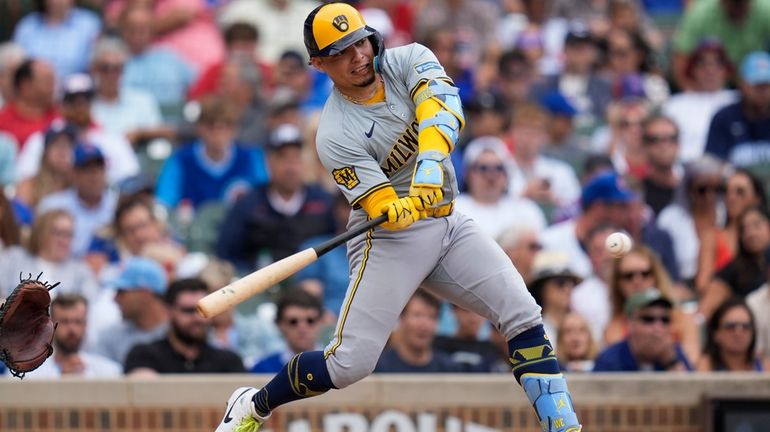 Milwaukee Brewers' William Contreras hits a double during the ninth...