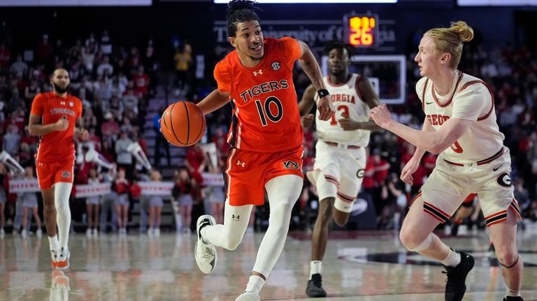 Auburn guard Chad Baker-Mazara (10) drives against Georgia guard Blue...