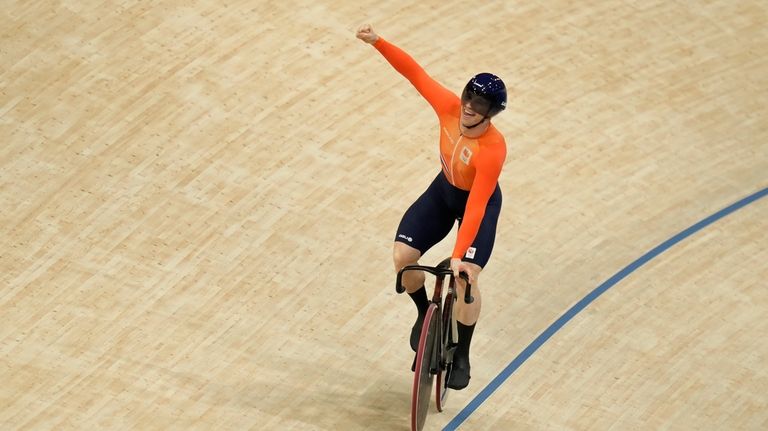 Harrie Lavreysen of Netherlands celebrates after setting the new world...