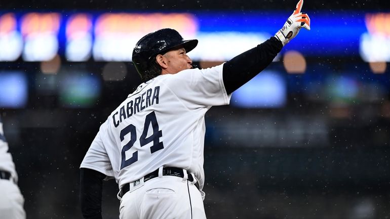 Detroit Tigers' Miguel Cabrera gestures after hitting a home run...