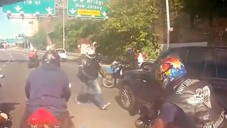 Bikers attack a Range Rover as a dispute transpires between...