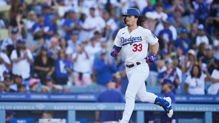 Los Angeles Dodgers' James Outman (33) runs the bases after...