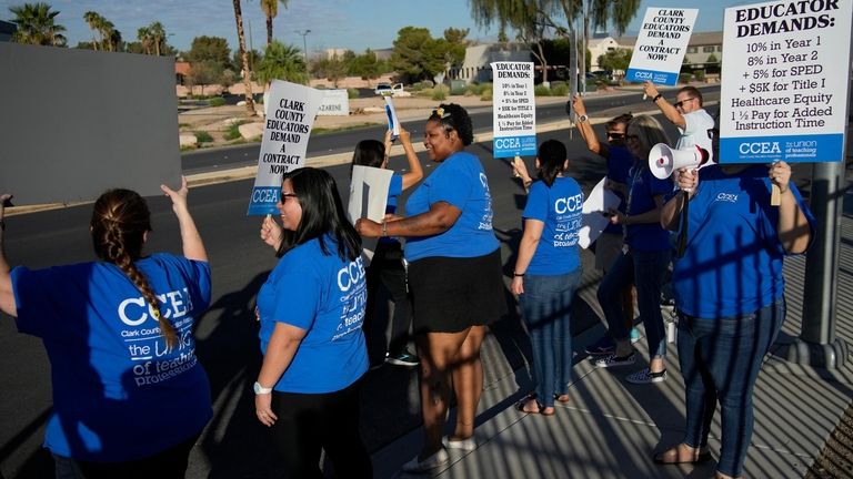 Teachers and members of the Clark County Education Association rally...