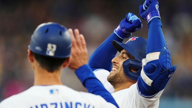 Toronto Blue Jays' George Springer (4) celebrates his RBI single...