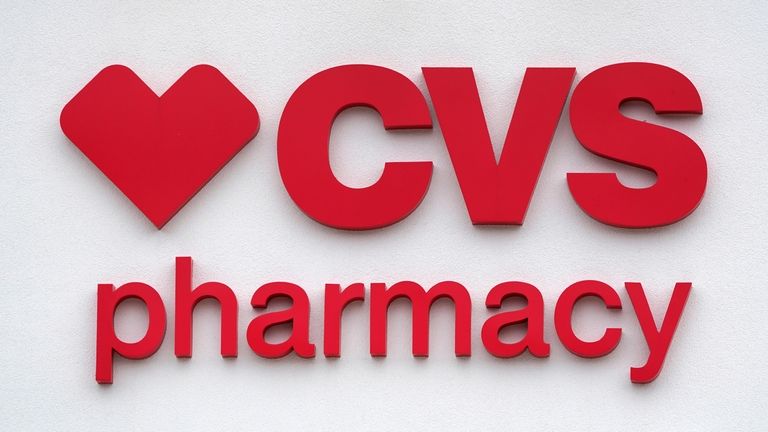 The CVS Pharmacy logo is displayed on a store on...