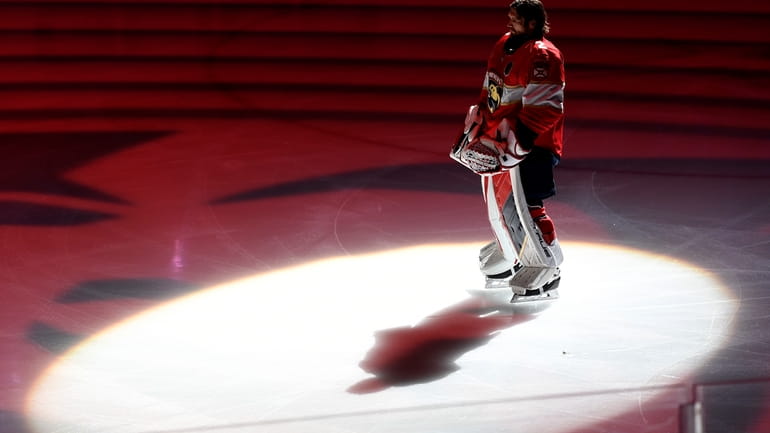 Florida Panthers goaltender Sergei Bobrovsky stands on the ice before...