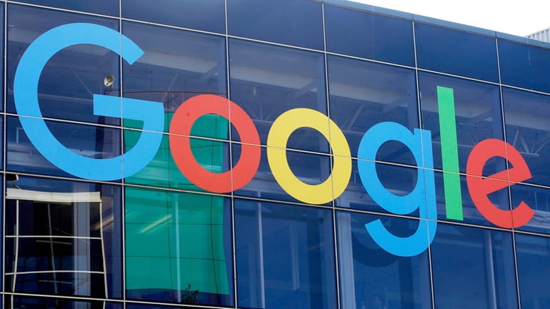 A sign is displayed on a Google building at their...