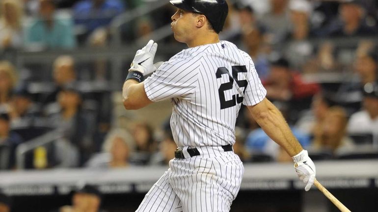 Mark Teixeira hits a game-tying two-run home run during the...