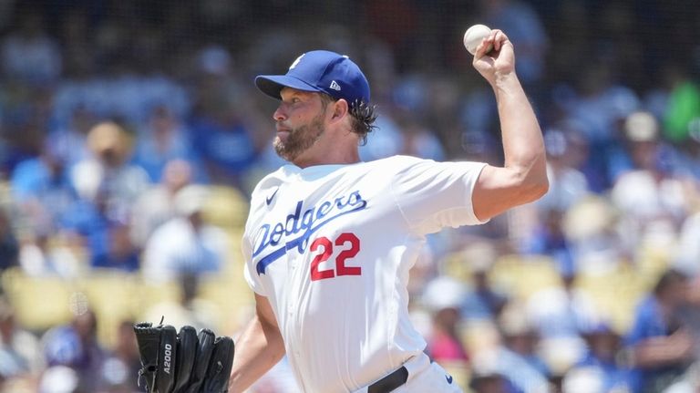 Los Angeles Dodgers starting pitcher Clayton Kershaw (22) throws a...