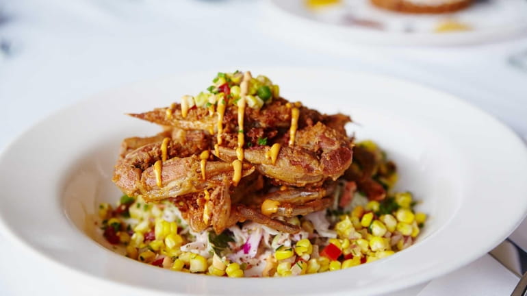 Crisp, flash-fried soft-shell crab is served with a corn salsa...