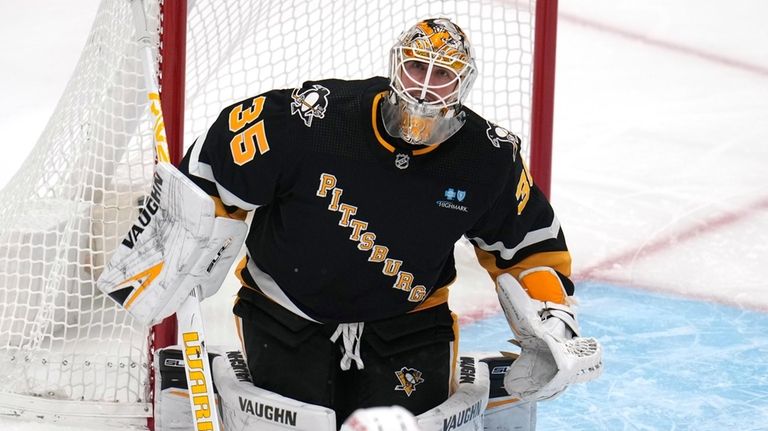 Pittsburgh Penguins goaltender Tristan Jarry (35) keeps his eye on...