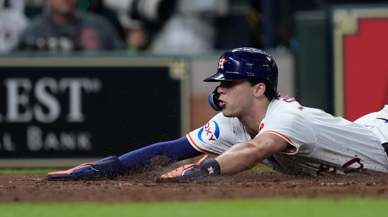 Houston Astros' Joey Loperfido scores on an RBI double by...