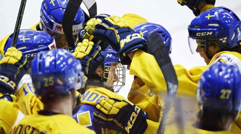 Alexander Nylander, center, of Sweden and teammates celebrate after Nylander...