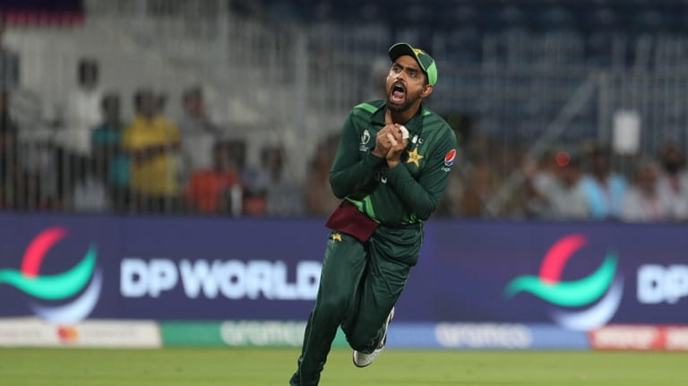 Pakistan's captain Babar Azam takes a catch to dismiss Aiden...