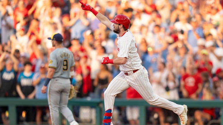 Philadelphia Phillies' David Dahl reacts after his home run during...