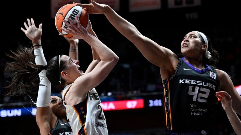 Connecticut Sun forward Brionna Jones (42) blocks a shot by...