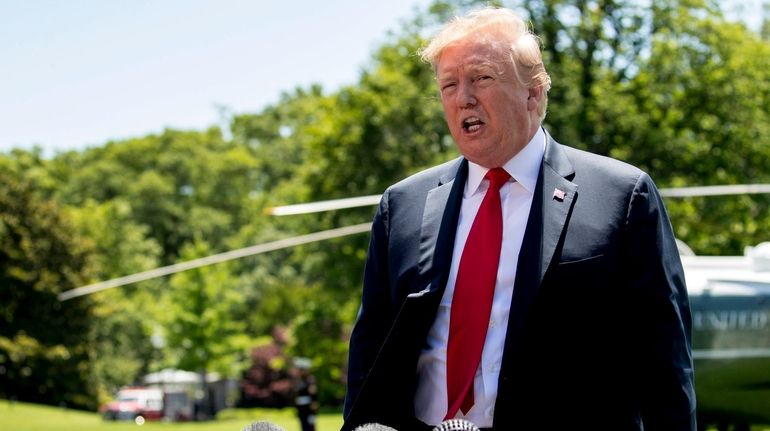 President Donald Trump speaks to members of the media on...