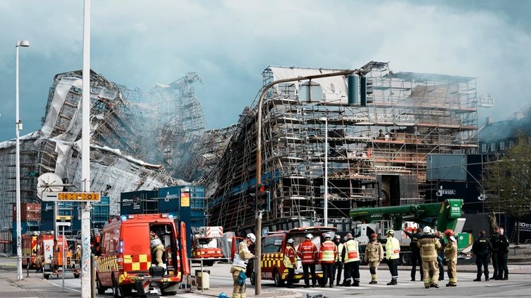 The outer wall of the Stock Exchange has collapsed towards...