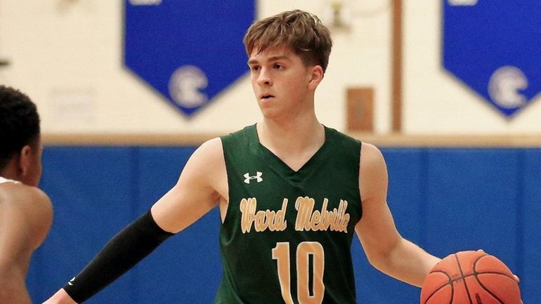 Ward Melville guard Jack Holland sets up the play at...