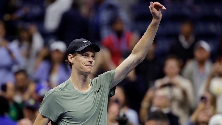 Jannik Sinner, of Italy, acknowledges the crowd after defeating Daniil...