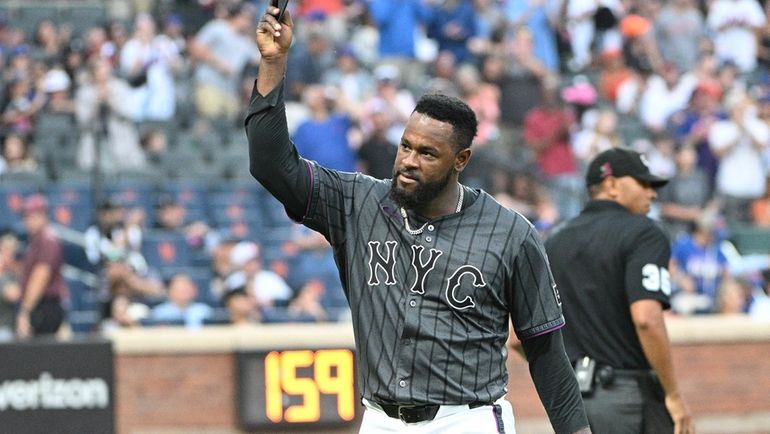 New York Mets starting pitcher Luis Severino tips his cap...