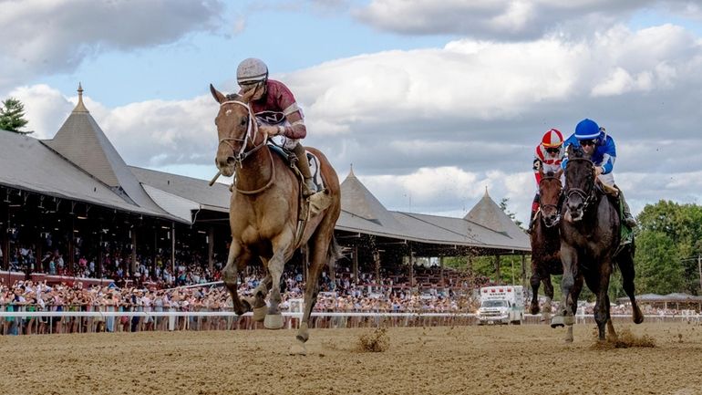 Epicenter, left, with jockey Joel Rosario, wins the Jim Dandy...