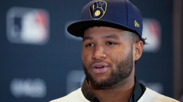 Milwaukee Brewers outfielder Jackson Chourio responds to questions following a...