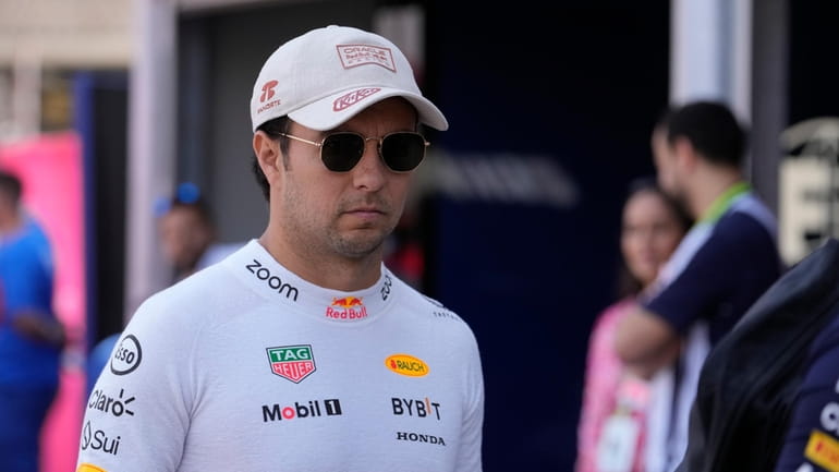 Red Bull driver Sergio Perez of Mexico arrives to the...