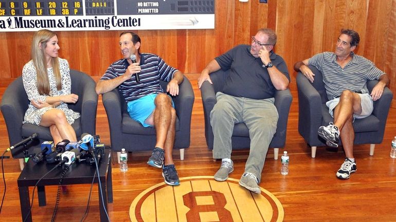 Members of Yogi Berra's family (from left, granddaughter Lindsay, sons...