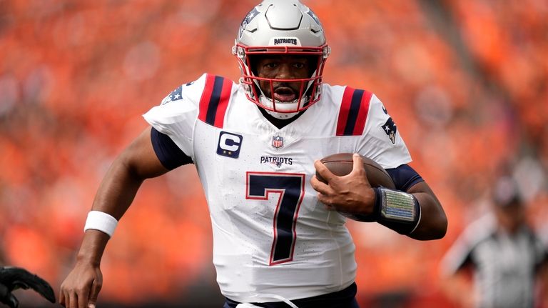 New England Patriots quarterback Jacoby Brissett (7) runs up field...