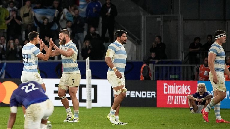 Argentina's players celebrates after the end of the Rugby World...