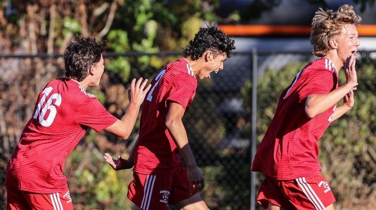 South Side celebrates a goal by Mike Benfante to put them...