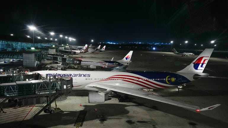 A Malaysia airlines plane parked at Kuala Lumpur International Airport...