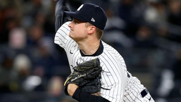 Clarke Schmidt of the Yankees pitches during the fourth inning against the...