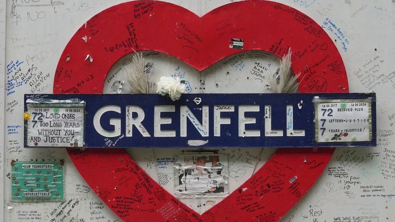 A view of the memorial wall by Grenfell Tower after...