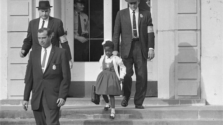 U.S. Deputy Marshals escort 6-year-old Ruby Bridges from William Frantz...