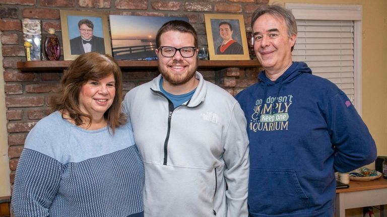 Christopher Tock, center, and his parents, Steve and Teresa Tock,...