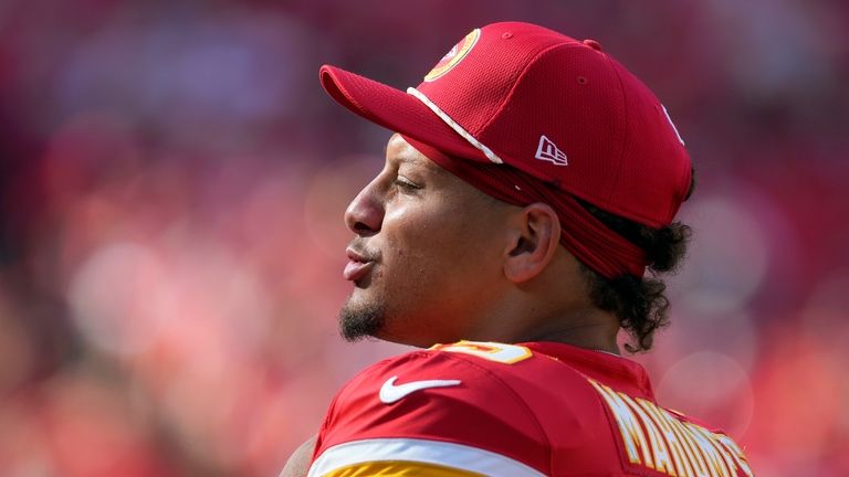 Kansas City Chiefs quarterback Patrick Mahomes watches from the sidelines...