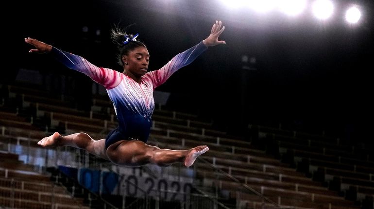 Gymnast Simone Biles returns and quietly wins a bronze medal...