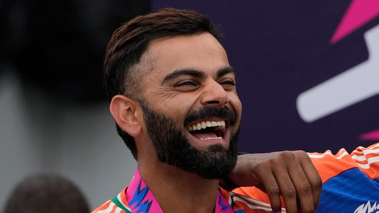 India's Virat Kohli shares a laugh with teammates at the...