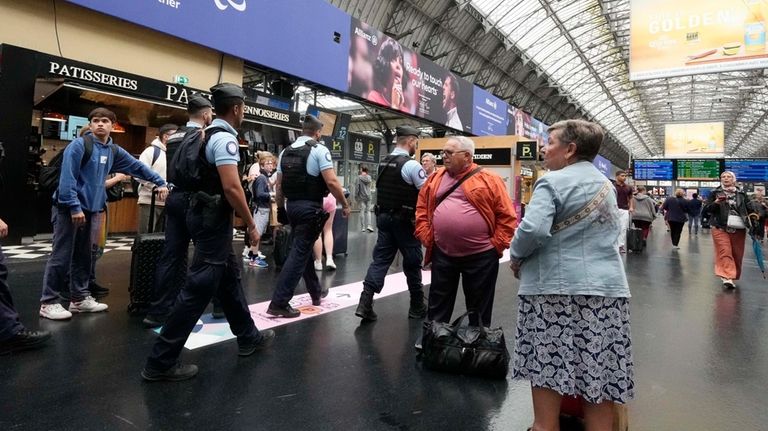 Police patrol the Gare de L'Est ahead of the 2024...